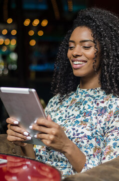 Woman enjoying leisure time with digital tablet