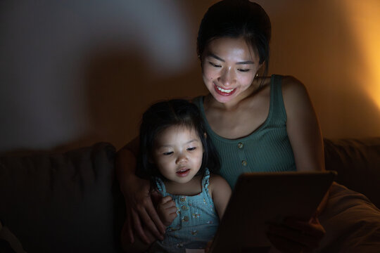 Mother and daughter enjoying digital story together