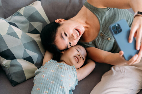 Mother and child taking selfie with smiling faces