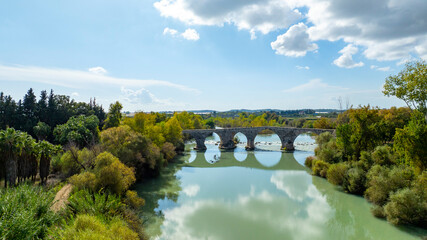 Fototapeta premium Belkis Koprusu areial dron photo. Seljuk bridge in Aspendos. The Eurymedon Bridge. Aspendos Yolu Belkis Mevkii. Turkey. Crooked Bridge over the Kopruchay (Euremedon) River near Aspendos, in Pamphylia,