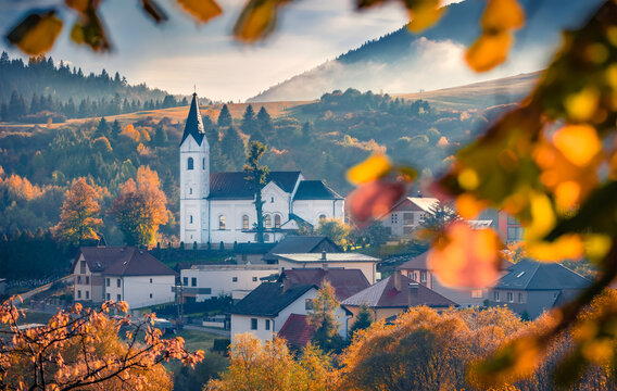 Stunninf autumn view of Catholic church of St. Michael the Archangel. Picturesque moening scene of Valaska Dubova, village and municipality in Ruzomberok District, Zilina Region, Slovakia, Europe.
