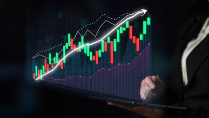 A business professional reviews financial data on a laptop, showcasing digital graphs that illustrate a positive upward trend, reflecting investment success. Copula