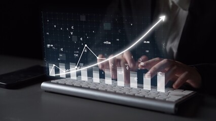 A close-up view of hands typing on a keyboard with a visually engaging financial graph overlay, symbolizing growth, analysis, and success in a digital workspace. Copula