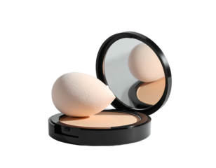 Compact powder with makeup sponge and reflective lid, on black background