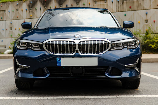 August 4, 2021, Seoul, South Korea - Front view of a blue BMW 320d Luxury car parked