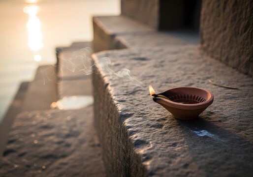 Clay oil lamp on ghat burning diya for diwali or ganga aarti ceremony