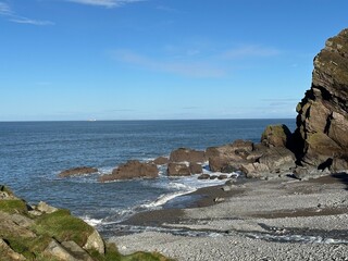 Sea waves crashing on the beach and rocks