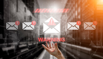 A hand reaches out towards floating email icons marked with warnings in a digital environment, emphasizing the importance of cybersecurity and awareness of potential threats. Gantry