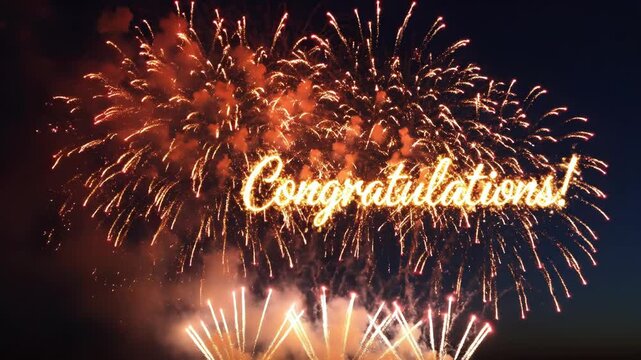 Fireworks display with congratulations message in the night sky