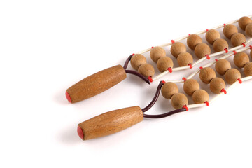 Wooden roller, ribbon massager on white background.