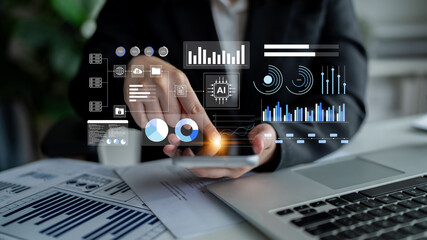 A business professional engages with a smartphone displaying advanced data analytics and AI visuals within a contemporary office environment. Gantry