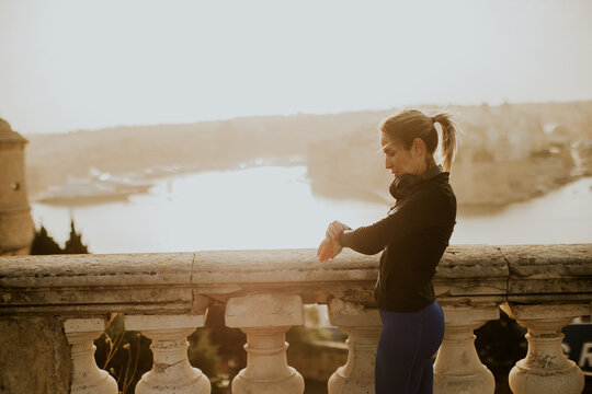 Woman enjoying a morning exercise routine with stunning views in Malta