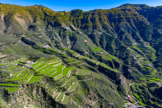 Aerial view of the Village of Tejeda in Granm canaria - Suyrrounded by beautiful farms in the valley Below the Roque Nublo and Roque Bentayga