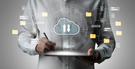 A business professional engages with a digital tablet, showcasing cloud storage ideas, data transfer processes, and the organization of documents in a modern workspace. Gantry