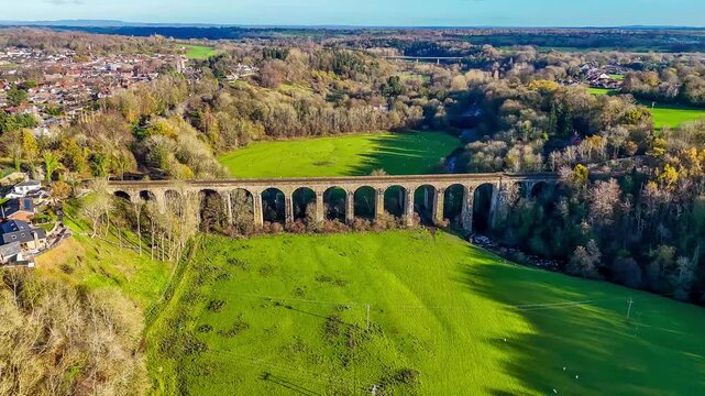 A distant rotating aerial view of the Chirk viaduct in Wrexham, Wales