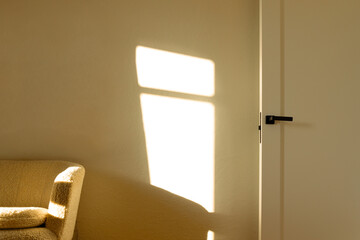 bright apartment room indoor space sofa door and neutral wall with square shape sun glare effect frame work pattern symmetry interior space