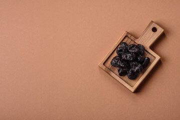 Fototapeta premium Sweet dried plums or prunes, organic dehydrated fruit for dietary nutrition. Prunes or dried plums