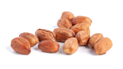 Hazelnuts kernels on a white background, healthy food. Macro