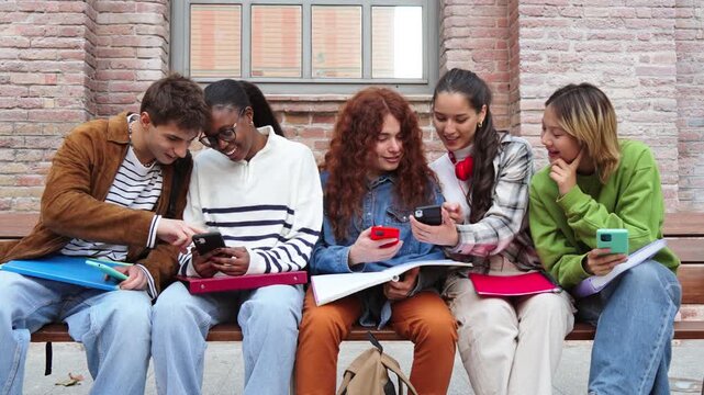 A lively group of five friends joyfully engaging in teamwork as they share insights and ideas about their studies, fostering an encouraging and supportive learning atmosphere among peers.