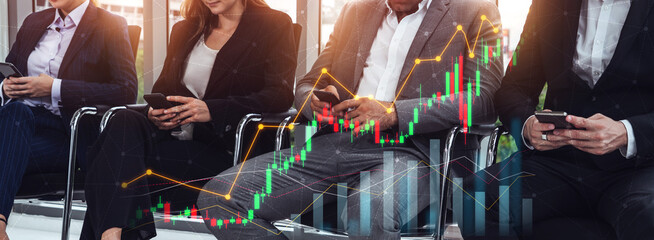 A group of professionals in business attire engaged in a meeting while analyzing financial data on smartphones. Graphs overlay highlight growth trends in a corporate setting. Scalp