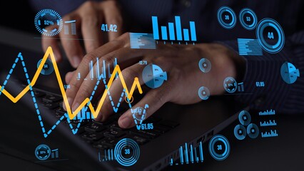 A professional workspace featuring hands typing on a keyboard, surrounded by digital graphs and charts representing growth and performance metrics in data analysis. Xenic