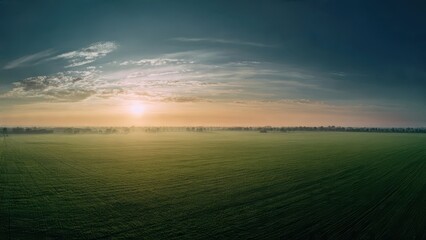 Aerial View of a Field at Sunrise