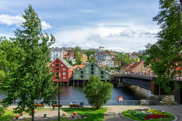 Fototapeta premium Scenic View of Gamle Bybro and Colorful Wooden Wharves on Nidelva River in Trondheim Norway