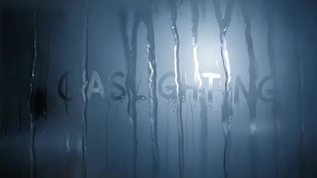 gaslighting concept Gaslighting written on a steamy, wet bathroom mirror with condensation