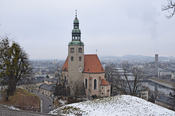 The Pfarrkirche M&uuml;lln on a foggy winter day.