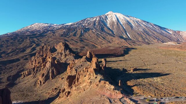 Morning mountain panorama, Vast wilderness captured at dawn with towering snowy mountains and calm sky. Teide. Tenerife. Spain