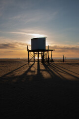 lifeguard hut backlit on the beach