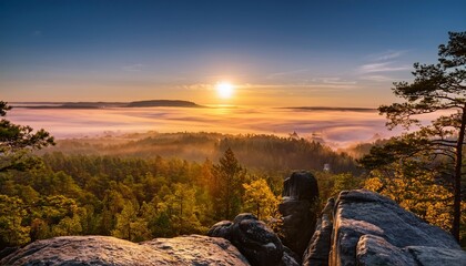 Golden Sunrise Over A Foggy Forest From A Rocky Viewpoint