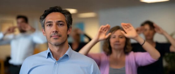 A group of participants engage in a yoga session indoors, promoting wellness.