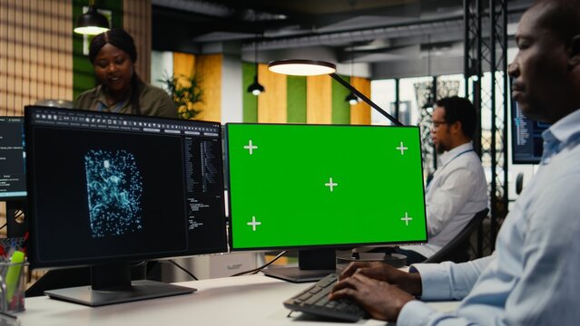 Isolated screen computer used by technician in AI startup office to train predictive models for language processing tasks. IT expert uses deep learning technology on chroma key PC, camera A - Powered by Adobe