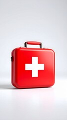 Obraz premium Red First Aid Kit with White Cross on Gray Background