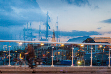 Reflections of kampen's twilight: a bridge-bound journey through cityscape and water