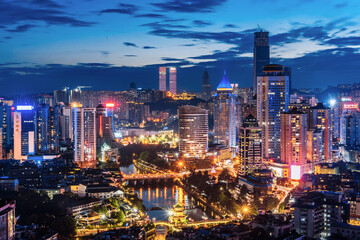 High angle night view of Jiaxiu Tower and city skyline in Guiyang, Guizhou Province, China