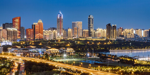 Fototapeta premium High angle night view of the Guomao CBD complex in Haikou, Hainan Island, China