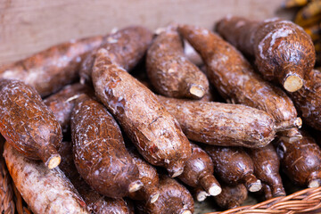 Close-up of natural yucca roots in basket on shop counter