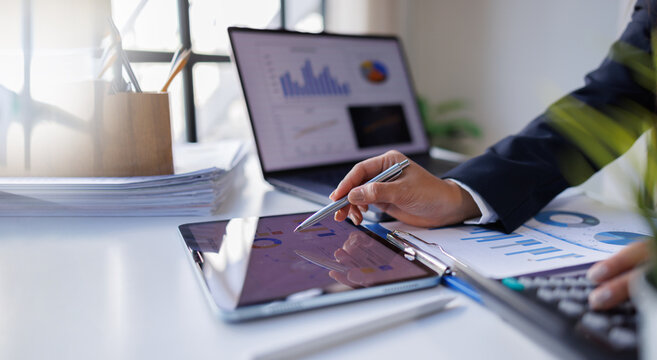 Business professional investor working new start up project. tablet laptop computer with digital marketing media in virtual icon design Finance managers meeting.
- Powered by Adobe