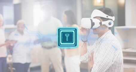 Adjusting Asian man testing VR headset using hologram chip key in office plaid shirt, copy space