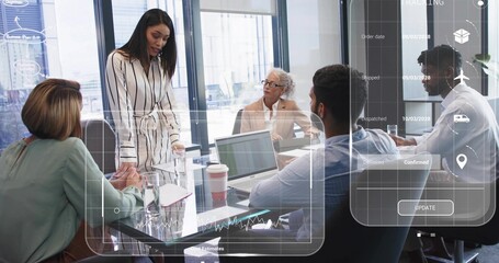 Presenting woman in striped dress leading meeting at glass table with laptops and data overlays