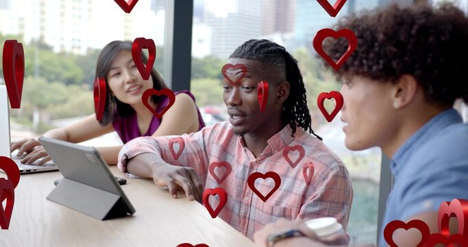 Pointing central man wearing pink plaid shirt at window counter, showing tablet, red heart overlays