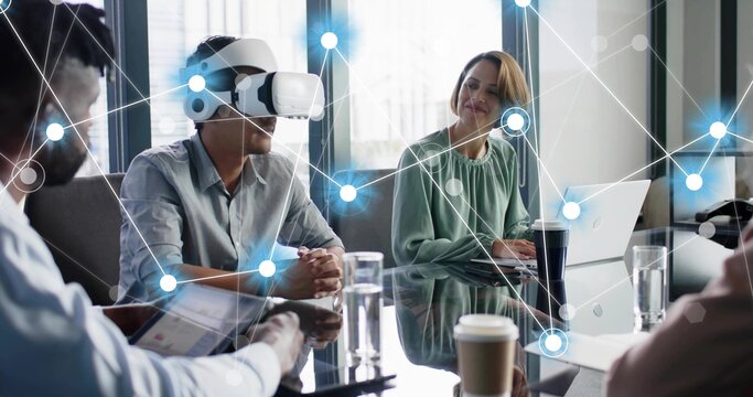 Testing business pro wearing white VR headset with hands on glass table, laptop, digital overlay - Powered by Adobe