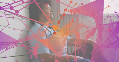 Resting healthcare woman wearing light blue scrubs and stethoscope by window with colorful overlay