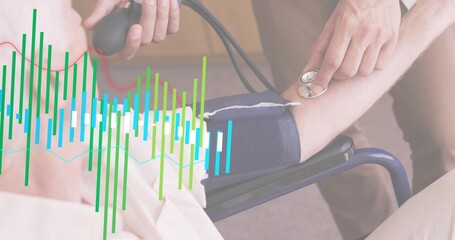 Measuring caregiver squeezing bulb on patient's cuffed arm in clinic, patient in gown, data overlay