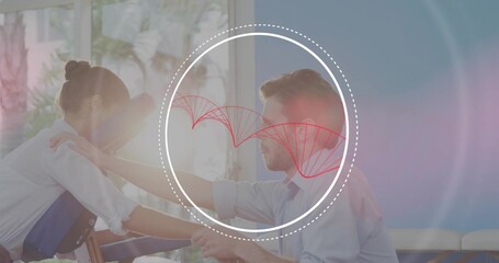 Massaging therapist in white blouse treating client in blue shirt on chair near windows, overlay