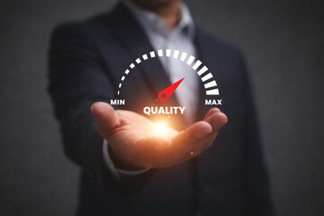 Businessman presenting quality gauge indicator showing performance level from minimum to maximum symbolizing quality control service excellence evaluation and business improvement concept