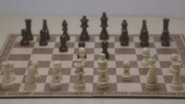 Standard piece development during the Grob's Attack. White improves his position by moving his pawn to d4 to strengthen the center.