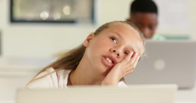 Diverse pupils with bored child resting gazing checking time poking desk in school by laptop